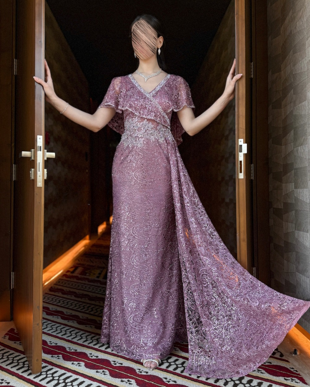 Pink evening dress with delicate embroidery and a side train