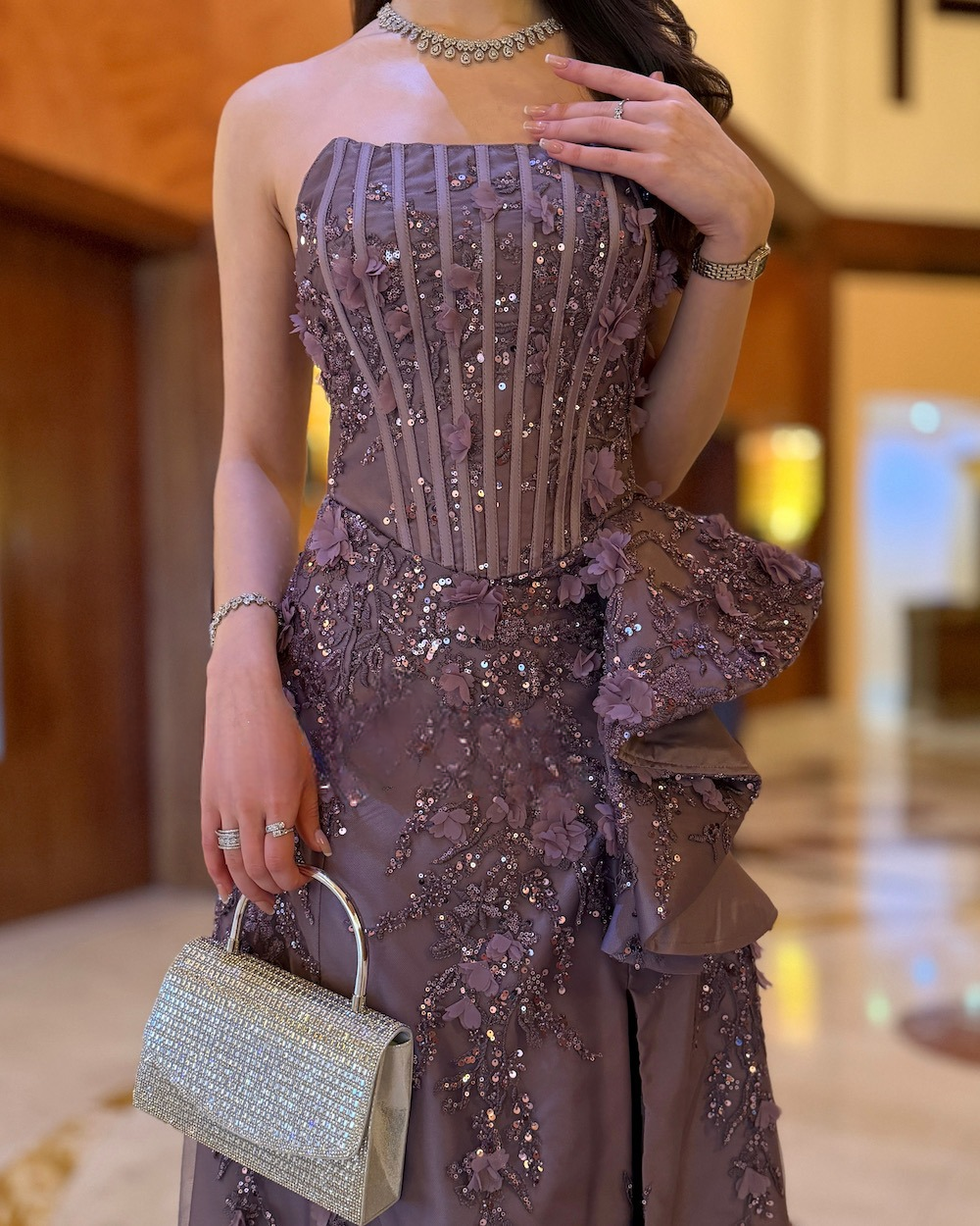 Purple evening dress with a corset bodice and embroidery