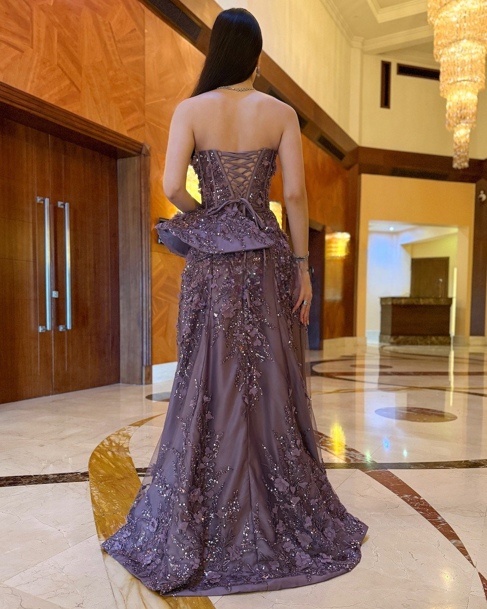 Purple evening dress with a corset bodice and embroidery