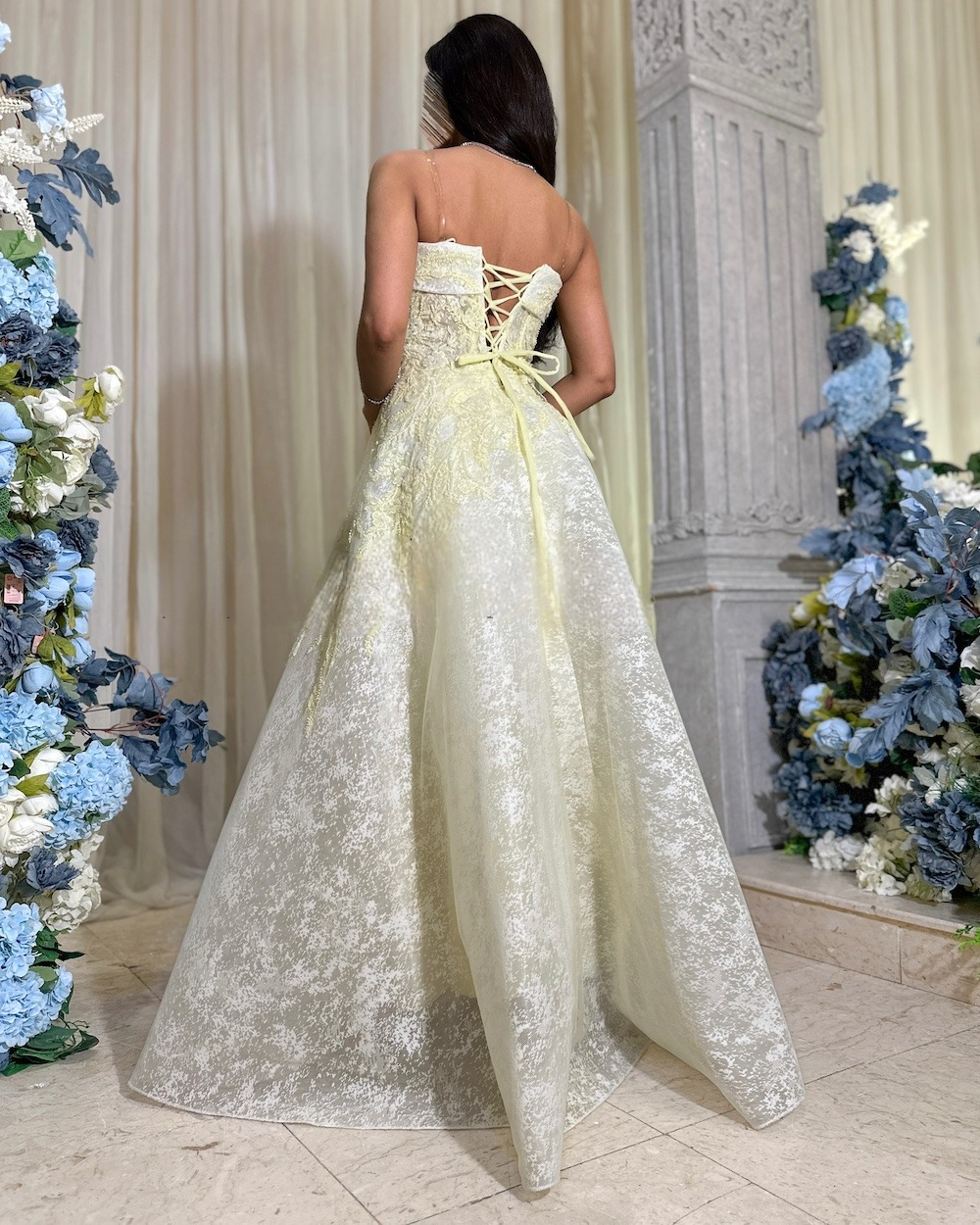 Light lemon evening dress with a sleeveless collar