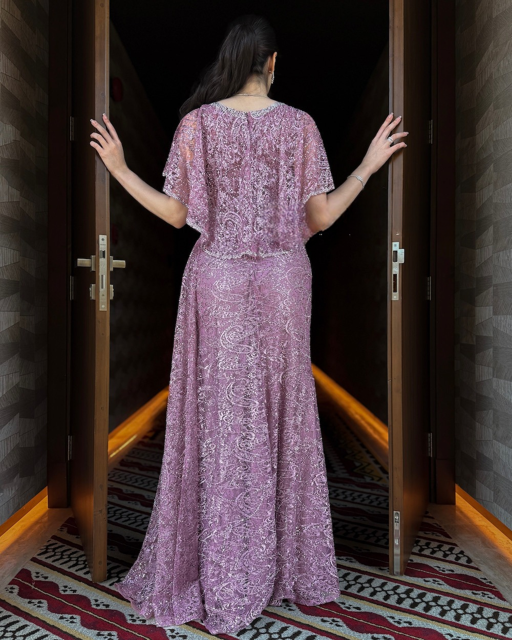 Pink evening dress with delicate embroidery and a side train