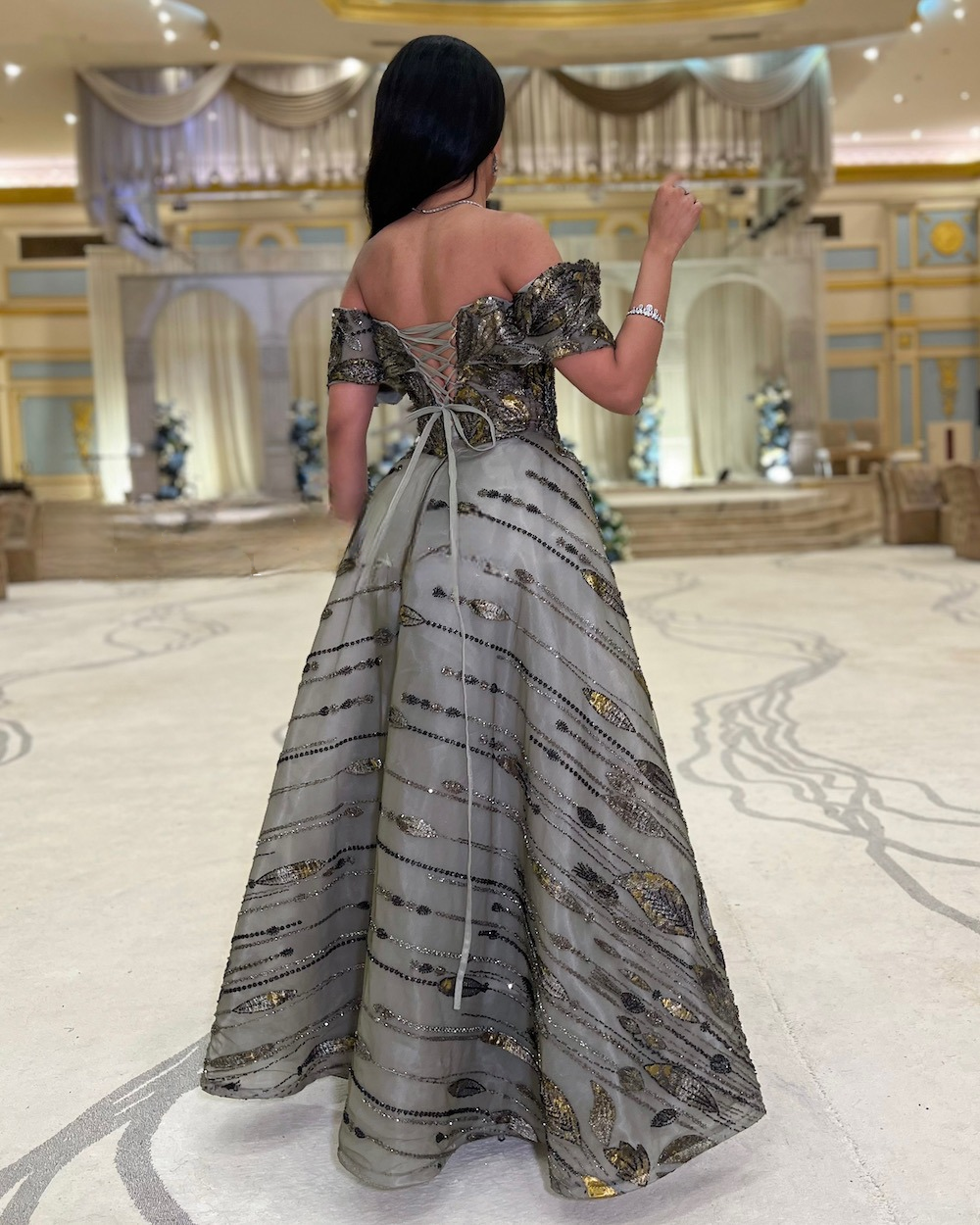 Gray evening dress with gold and glitter accents