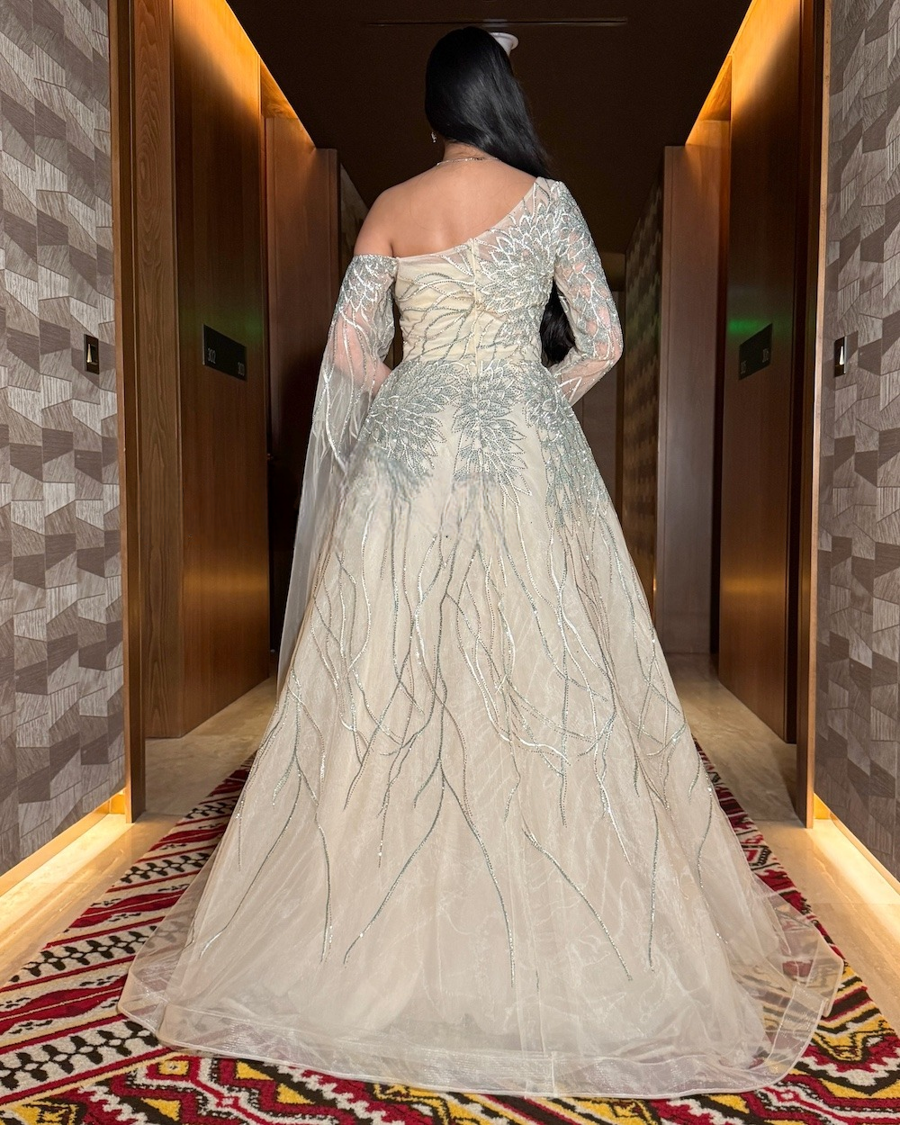 Luxury beige evening dress with sheer sleeves