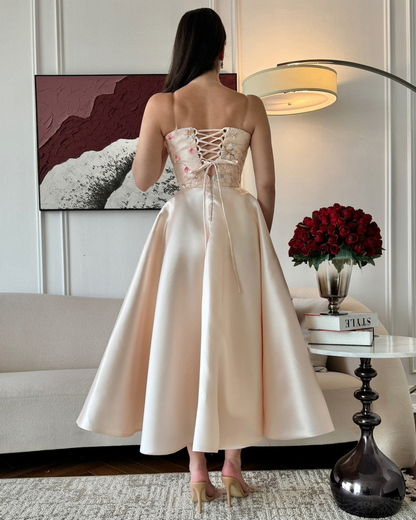 Beige Mikado evening dress with delicate floral embroidery